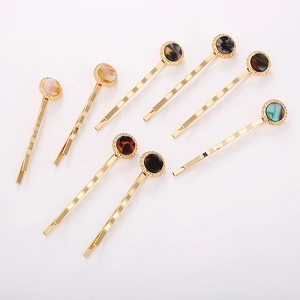 Set of 8 minimalist acetate round hair clips with gold metal base in diverse colors