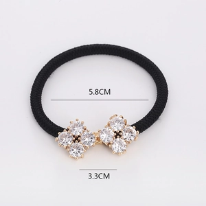 Elegant black elastic hair tie with sparkling crystal snowflake bow charm and gold setting