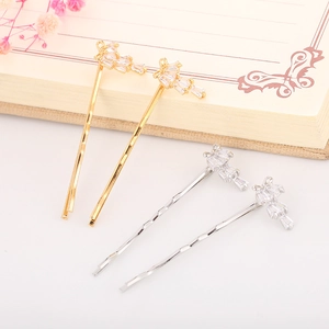 Elegant bow hair clip set with sparkling baguette and round zircons in gold and silver