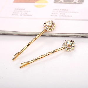 Lot de deux barrettes dorées avec motif de fleurs et strass en cristal étincelants