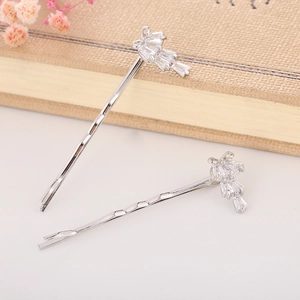 Detail of silver alloy hair clips with sparkling rectangle and round zircon crystals