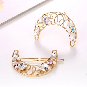 Elegant gold moon hair clips with crystals and pearls on a clean white background