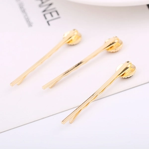Three-piece set of elegant gold round acetate hair clips in a minimalist creative design