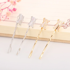 Elegant wave-shaped metal hair clips with rectangular cubic zirconia in gold and silver