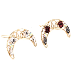 Elegant gold moon hair clips with colorful crystals and pearls on white background