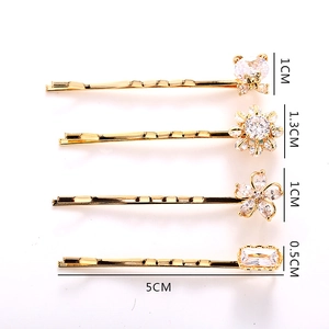 Detailed view of four gold hairpins featuring bear and flower motifs with 5cm length