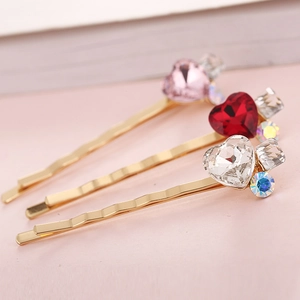 Set di 3 forcine dorate ondulate con cristalli a forma di cuore colorati e piccoli strass
