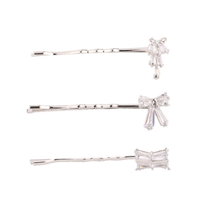 Three-piece silver bow hair clip set with sparkling cubic zirconia stones on white background