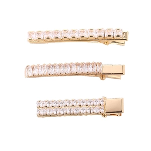 Three-piece gold-toned hair clips set featuring sparkling cubic zirconia and duckbill design