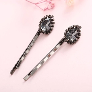 Elegant pair of wave-shaped hair clips with grey water drop crystal in black finish