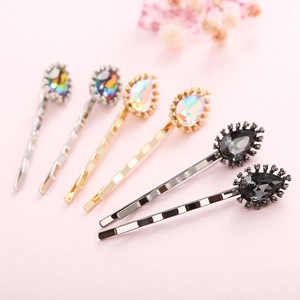 Detailed close-up of six crystal hair clips featuring pear-shaped rhinestones and metal alloy