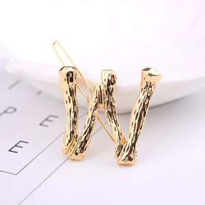 Elegant gold-plated alloy letter W hair clip with textured metal finish for women