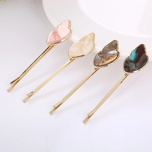 Set of 4 acetate marble shell hair clips with golden metal bases in soft pastel colors
