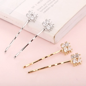 Barrettes à cheveux élégantes en strass étoilé doré et argenté avec design ondulé