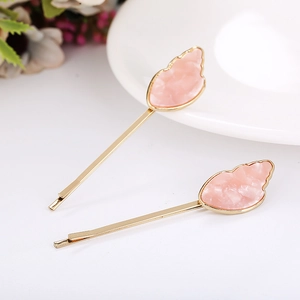 Pink shell acetate hair clip with golden alloy metal base and marble texture