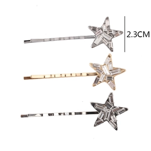 Lot de trois barrettes étoile en strass, coloris or, argent et noir, taille 2,3 cm