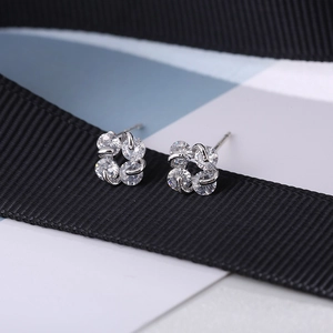 Detail view of S925 sterling silver flower stud earrings with clear cubic zirconia stones