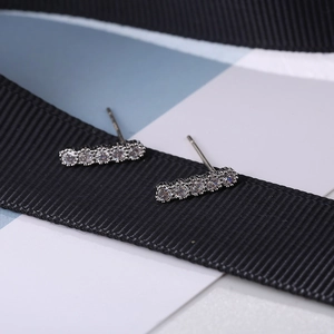 Macro shot of S925 sterling silver bar earrings with five clear cubic zirconia stones