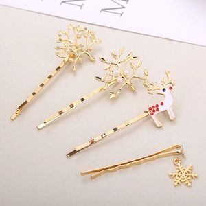 Golden Christmas hair clip set with reindeer, snowflake and pearl branch design