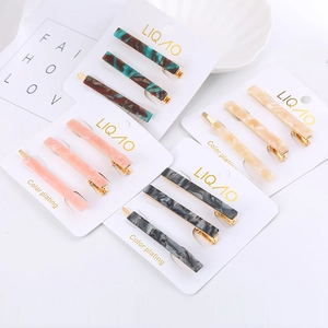 Chic acetate hair clip sets with gold metal finish and marble patterns in diverse colors