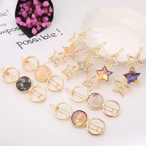 Eleganti fermagli geometrici in acetato a forma di stella e cerchio con montatura oro