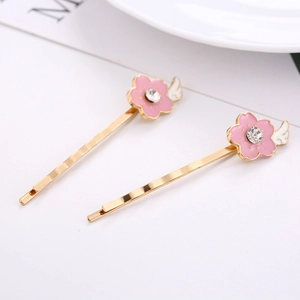 Barrettes à cheveux fleurs de cerisier dorées avec émail rose et cristaux brillants