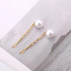 Elegant gold pearl hair pins set with minimalist wavy design for women's hairstyle