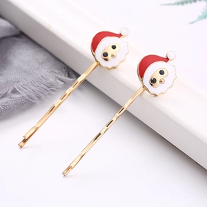 Golden Santa Claus hair clips with red enamel finish for festive Christmas hair accessories