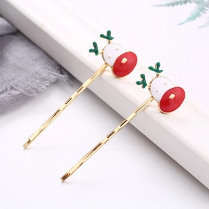Pair of festive golden reindeer hair clips with green antlers and red nose decorations