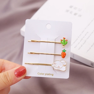 Set van drie kleurrijke haarclips met honden- en konijnenmotieven op goud metaal
