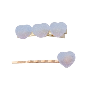 Rainbow gradient heart hair clips in blue and purple resin with glitter finish