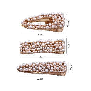 Three-piece set of white faux pearl hair clips with golden alloy rectangular and drop shapes