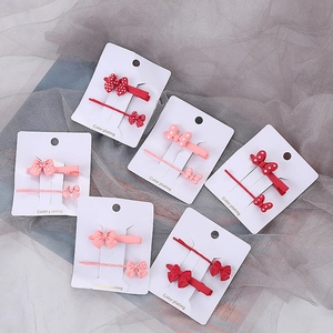 Ensemble chic de 6 pinces à cheveux à nœuds à pois avec clips mats sur carte de support