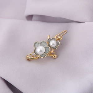Classical Chinese style hair clip featuring gold flowers with dark grey petals and pearls