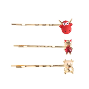 Lot de trois barrettes dorées avec motif de bœuf et détails rouges pour le Nouvel An