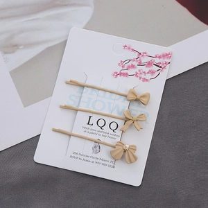 Lot de trois barrettes à cheveux nœuds beige crème avec finition en métal mat chic