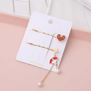 Elegant gold hair clip set with brown auspicious cloud motif and white pearl tassels