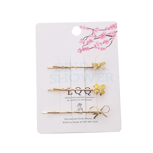 Lot de trois barrettes à cheveux à nœud jaune sur carte florale élégante