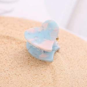 Blue and pink marble heart-shaped hair claw clip with acetate finish and gold spring