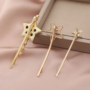 Detailed back view of a three-piece gold star hair clip set featuring alloy plating finish