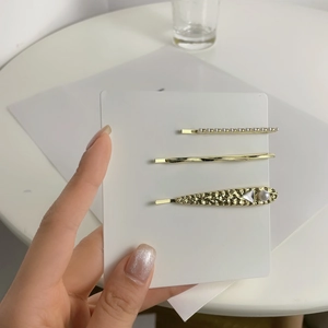 Three-piece gold metal hair clip set with pearls and crystals in minimalist French style