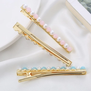 Elegant pearl and crystal duckbill hair clips with gold-plated metal base for women