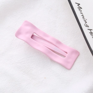 Pink matte wavy rectangular hair clip with a minimalist sweet style for women