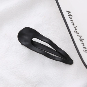 Matte black hollow metal BB hair clip with a sleek minimalist drop-shaped design