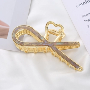 Elegant gold metal shark hair clip with gradient inlay and heart-shaped handle