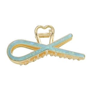 Elegant gold metal shark clip with blue marble pattern for ponytail styling