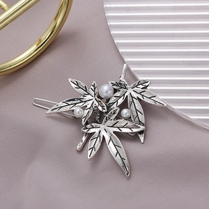 Elegant maple leaf hair clip with pearls in vintage silver finish on satin
