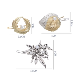 Detailed views of three metal leaf hair clips with dimensions and pearl accents