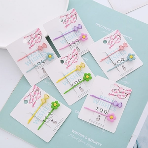 Lot de barrettes à fleurs et nœuds sur cartes cadeaux en couleurs pastel variées