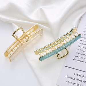 Large rectangle acetate hair claw clips in cream white and translucent blue with gold metal